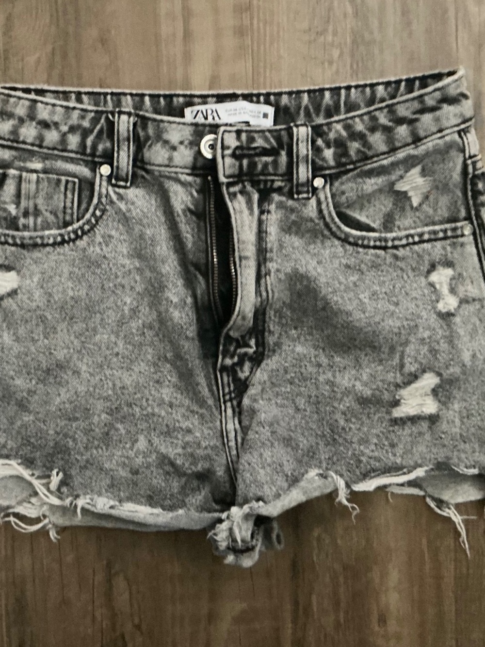 Zara distressed denim shorts in a washed gray / acid-wash black tone, size 4